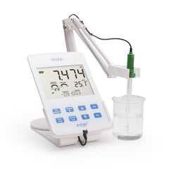 Benchtop pH/ORP meter HI2002 with a digital display, functional buttons, and a probe attached with a stand.