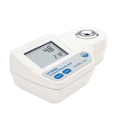 A digital refractometer for fructose measurement with a white body, display screen, and a sample well.