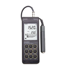 A Hanna Instruments portable EC/TDS/Salinity/Temperature Meter, model HI9835, with a digital screen and various measurement buttons.