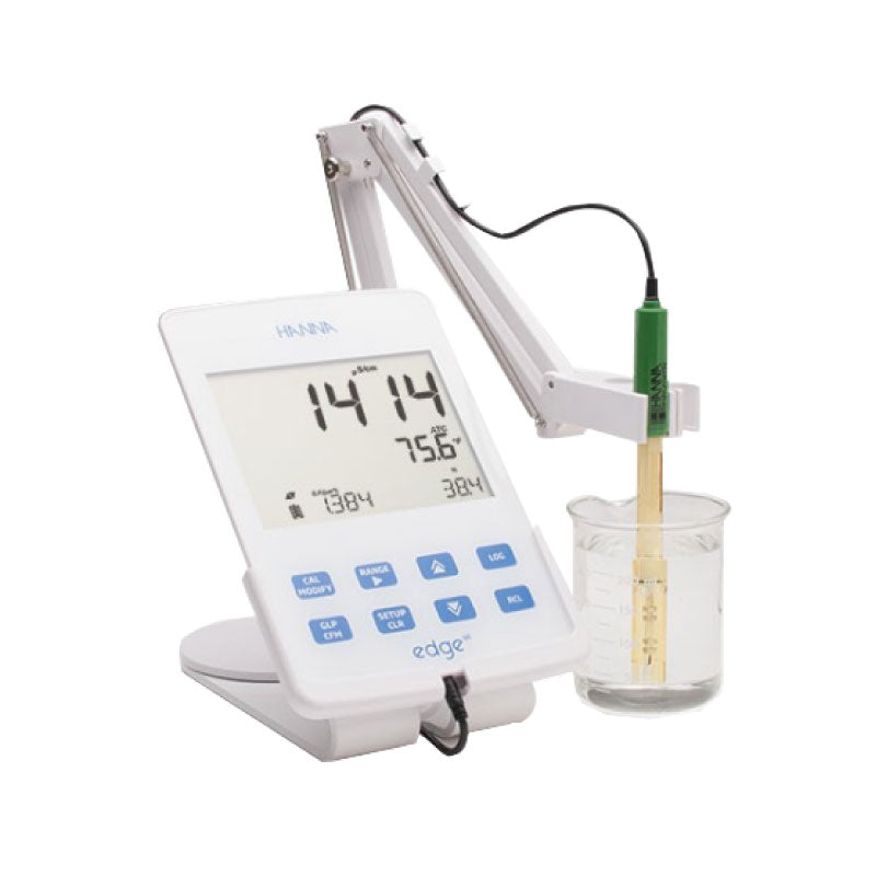 Lab equipment Hanna HI2003 conductivity meter with digital display and probe in a beaker on a white background