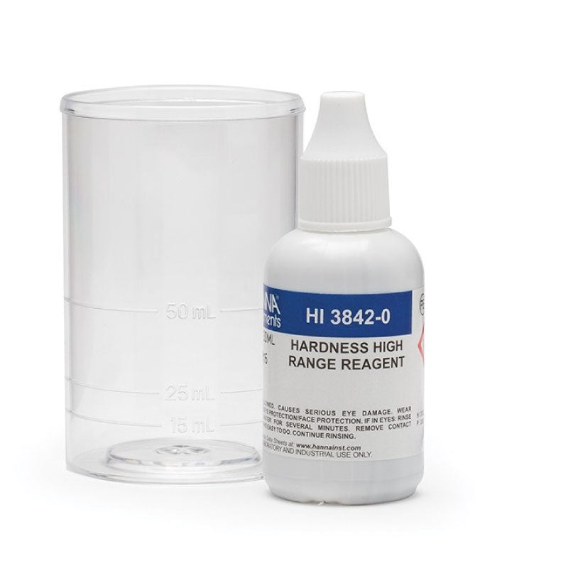 A bottle of Hanna Total Hardness HR Test Kit HI3842 reagents with a dropper bottle, labeled for 400-3000 mg/L, next to a clear beaker.