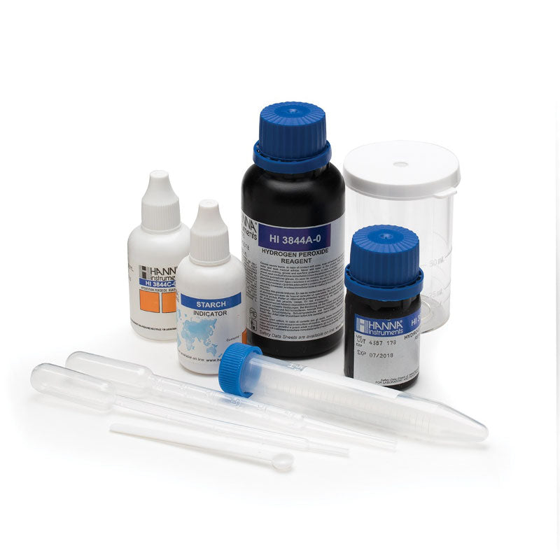 A collection of reagents and tools for a hydrogen peroxide test kit HI3844, including bottles, a color indicator, and plastic pipettes.